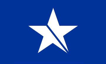 [  It is medium blue with a large white star, with the addition of a narrow blue descending stripe across the star, from the point of the lower right arm to the opposite vertex]