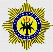 [South African Police Service badge]
